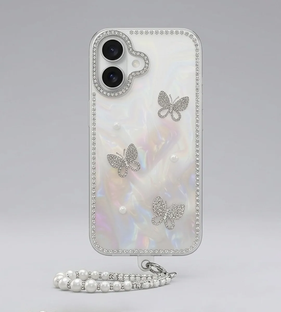 IPHONE 17 SERIES LUXURY PEARLESCENT BUTTERFLY CHARM CASE WITH DUAL PEARL & CRYSTAL WRISTLET