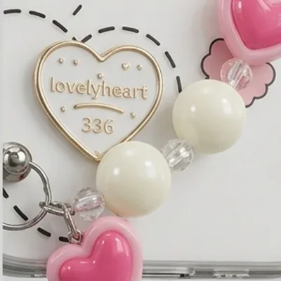 IPHONE 17 SERIES LOVELY HEART CLEAR: 3D RAINBOW ACCENTS, BEADED HEART CHARM, PREMIUM TRANSPARENT PROTECTIVE COVER — alternate view